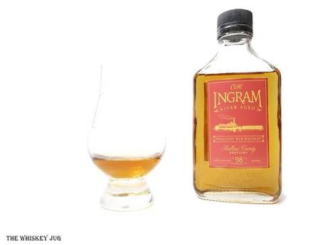 White background tasting shot with the O.H. Ingram Rye Whiskey bottle and a glass of whiskey next to it.
