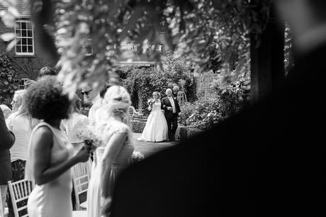 Bride walking up ailse at outdoor Grays Courtwedding
