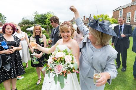 Bride's mom covers her in confetti at Grays Court Wedding