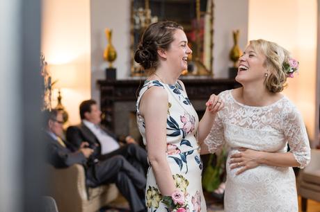 Bride laughs with sister at Grays Court Wedding