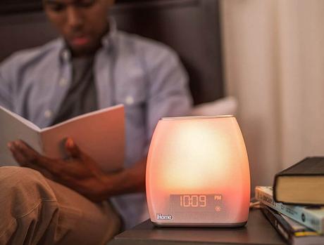 Reading next to the iHome Zenergy Bedside Sleep Therapy Machine