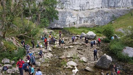 A group hiking meeting up in the Yorkshire Dales using the Hiiker app A picture containing outdoor, rock, nature, people
Description automatically generated