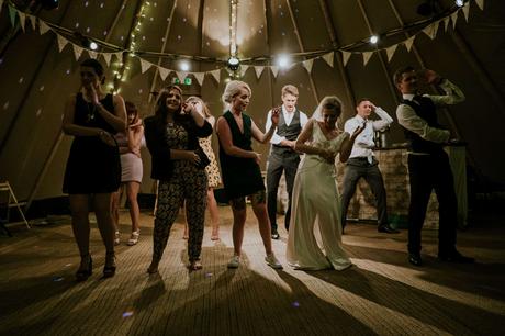 people having fun and dancing in a wedding party