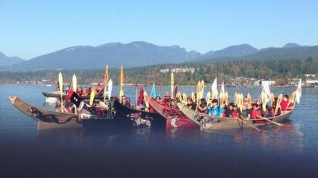 B.C. First Nation, the Tsleil-Waututh, were joined by environmentalists Monday, as they crossed Burrard Inlet in canoes to protest Kinder Morgan's proposed pipeline expansion. (CBC)