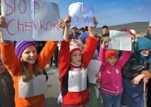 AFP/AFP - Children hold placards reading 