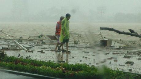 People walk along the Han river as Typhoon Nari hits the central coastal city of Da Nang in Vietnam.
