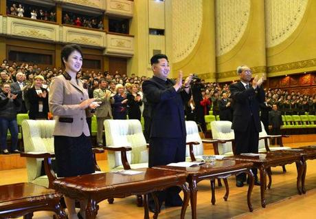 Kim Jong Un (C) and his wife Ri Sol Ju (L) applauds during a performance by Russia's Orchestra of the 21st Century, given to mark the 65th anniversary of DPRK-Russia relations at the East Pyongyang Grand Theater on 15 October 2013.  Also seen in attendance is KWP Secretary Kim Ki Nam (R) (Photo: Rodong Sinmun).