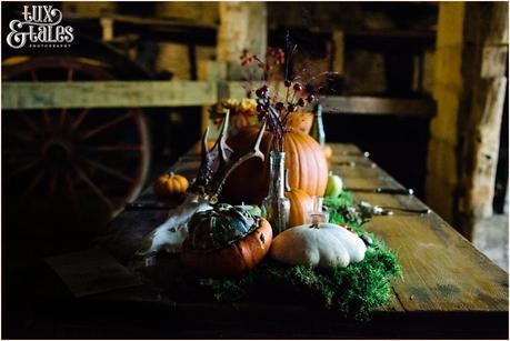 Autumn themed wedding table with pumpkins and moss