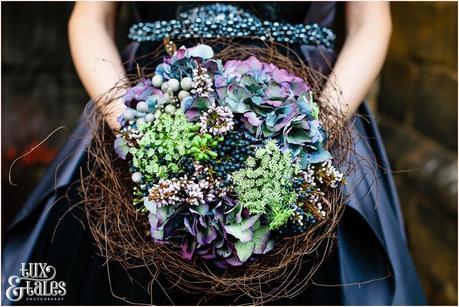Hydrangea bouquet in bridsnest alternative wedding flowers black wedding dress