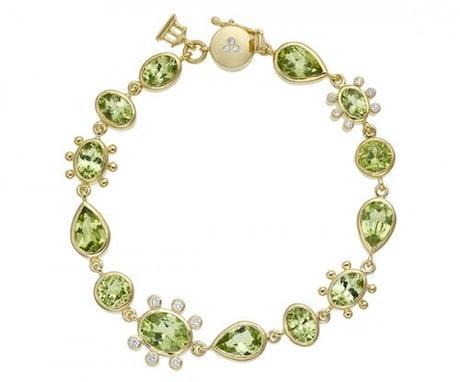 18 karat halo link bracelet with faceted peridot and diamonds