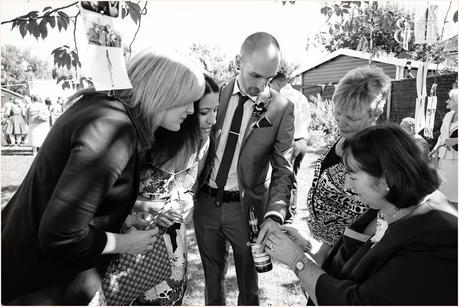 Wedding Photograph of bride showing ring to mother