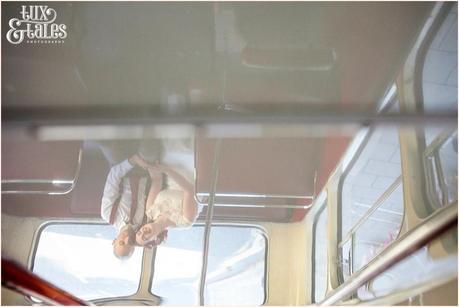 refelction of bride and groom on london wedding bus