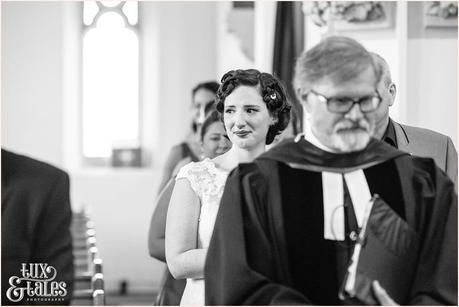 Bride cries as she walks up the aisle in tattooed bride wedding 