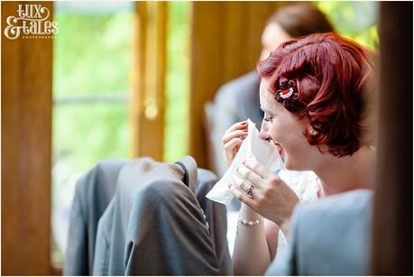 red headed bride cries at wedding 