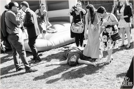 Bridesmaid falls out of bouncy castle and photographer snaps picture