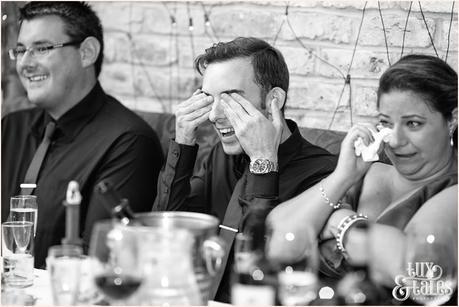 Guest covers his eyes in a joke at wedding 