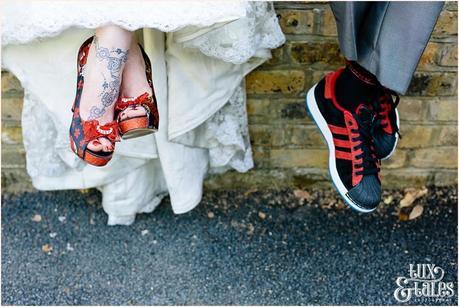 Bride & grooms red and black shoes tattooed