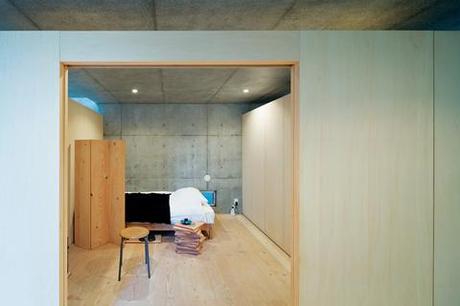 open plan concrete home in japan bedroom 