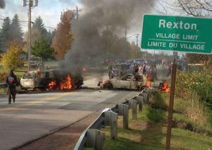 Two police vehicles torched, Oct 17, 2013.