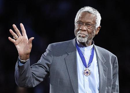Boston Celtics' legend Bill Russell stands with his Presidential Medal of Freedom during the NBA All-Star basketball game in Los Angeles, in this file February 20, 2011 photo. REUTERS/Danny Moloshok