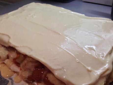 white chocolate topping on caramel apple opera cake layered