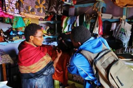 Govinda explains the merits of a high-end cookstove to a potential customer.