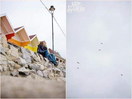 Engagement shoot in front fo rainbow coloured beach huts scarborough wedding photography