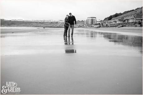 beach engagement photography poses with reflections in the sand