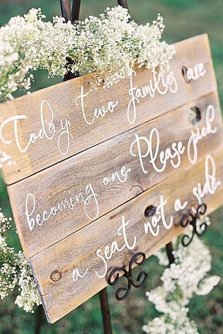 popular wedding signs board with an inscription decorated with baby breath