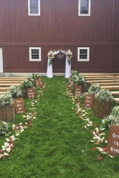 popular wedding signs decorate the wedding aisle h&k weddings and events via instagram