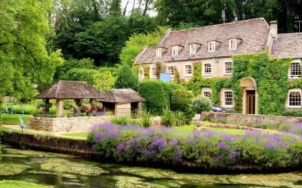 Enchanting Travels - Europe Tours - Picturesque garden in the Cotswold village of Bibury, England