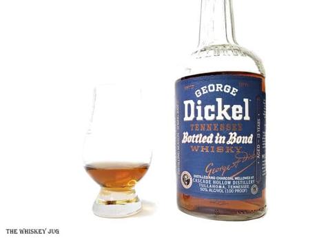 White background tasting shot with the George Dickel Bottled In Bond Spring 2007 13 Years bottle and a glass of whiskey next to it.
