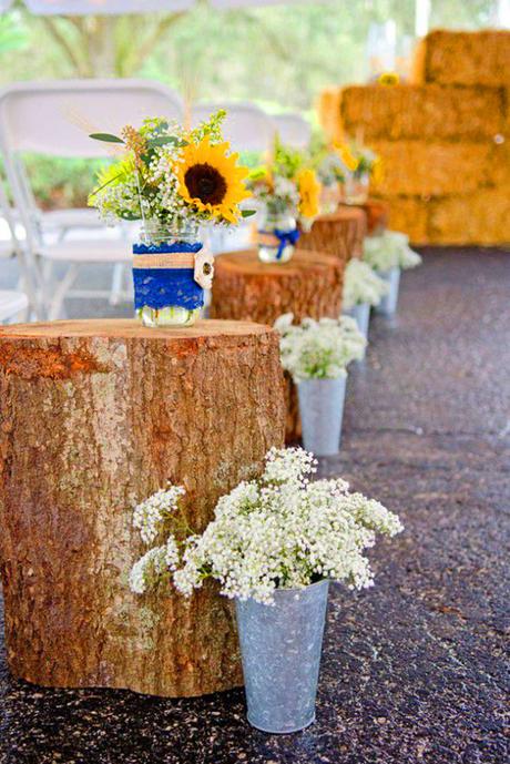 sunflower wedding decor ideas aisle with stumps jessegilesphotography