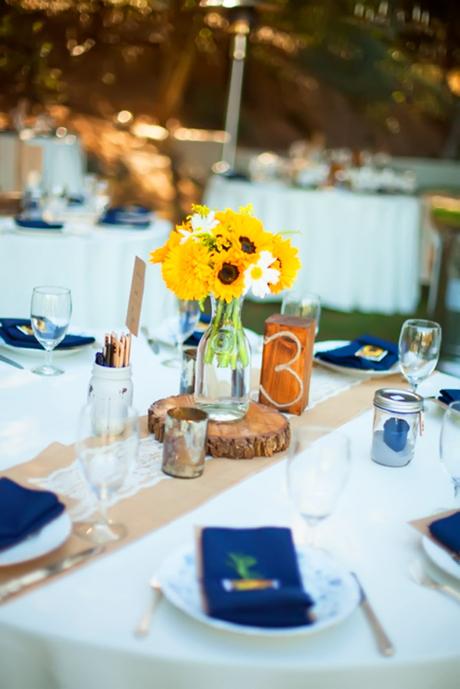 sunflower wedding decor ideas table witn blue napkins jillianhogan