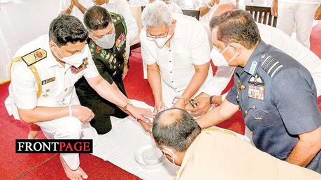 An alms giving at the Sanda Hiru Seya