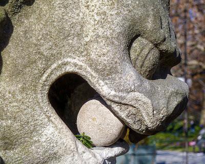 Red branches, lion's head, and the peeping sun