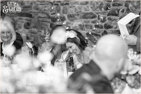 bride laughs during speechest at wedding at New House Farm in the lake district