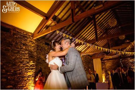 Bride and groom embrace during first dance