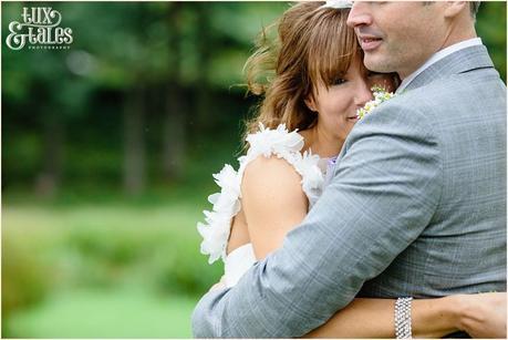 Bride and groom embrace at lake buttermere wedding 