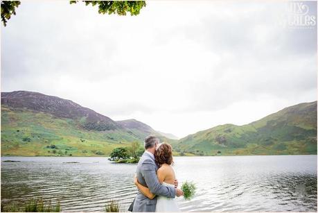 Brid e& groom look out over lake buttermere