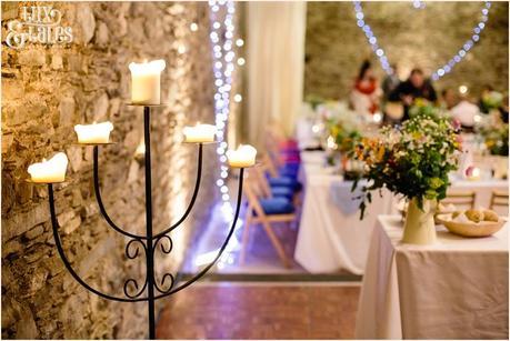 Barn wedding details with candelabra and fairy lights at Lake District wedding 