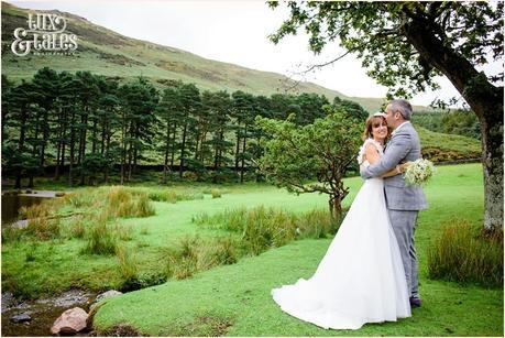 Bride and groom at LAke District Wedding by the water