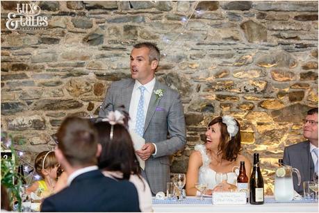 Groom gives a speech in the barn at New House Farm int he Lake District 