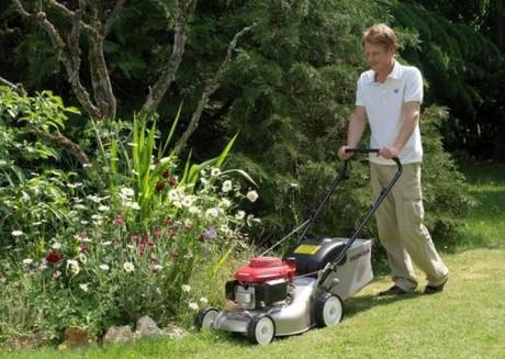 honday izy being used to mow lawn
