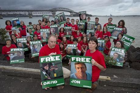 Greenpeace volunteers and staff protest in front of the Auckland Harbour Bridge, New Zealand, in support of the 28  Greenpeace International activists, as well as a freelance photographer and a freelance videographer currently in custody pending investigations into a peaceful Arctic oil protest.