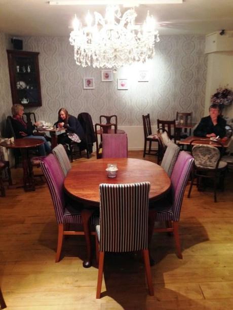 the walk cafe nottingham 2013 chandelier above purple themed dining table and chairs