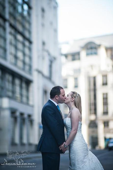 Bride and Groom kissing in the middle of the road in London