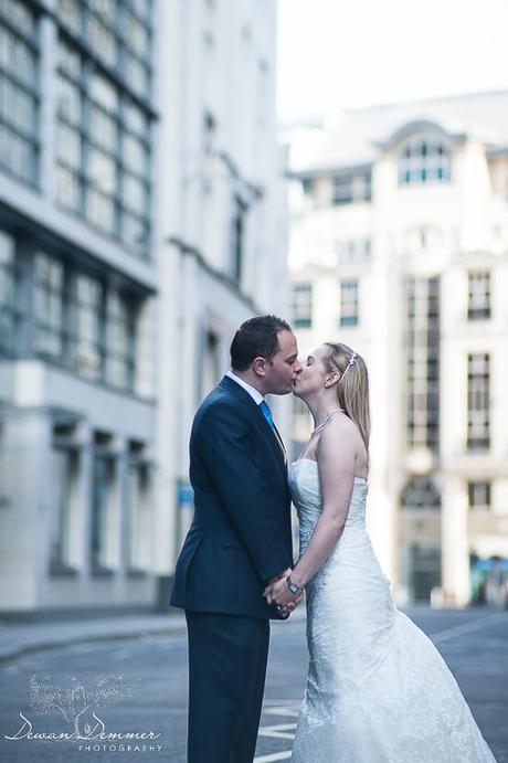 Bride and Groom kissing in the middle of the street in london