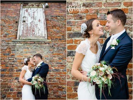 Barmbyfield Barn wedding Photography couple in front of brick wall 