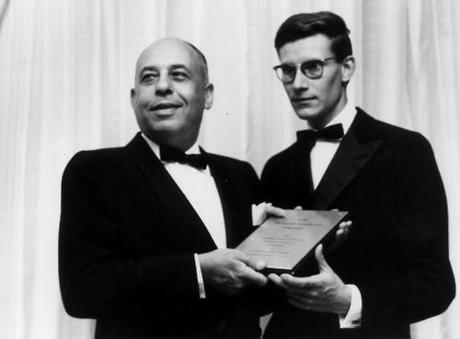 Stanley Marcus presenting Yves Saint Laurent with the Neiman Marcus Fashion Award in 1958.